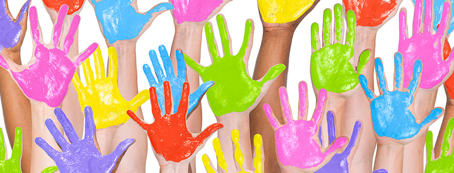 Picture of many hands that are covered in paint (purple, green, blue, yellow, pink, and red)